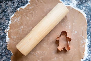 Gingerbread cookie cutter on dough