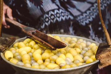 Old Thai Produce the Silk from Silkworm egg 