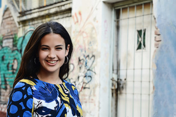 Close up of a young woman outdoors.