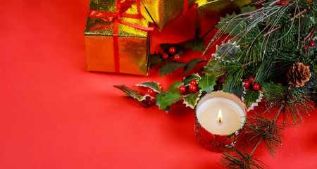 Christmas gift with holiday decorations, light background