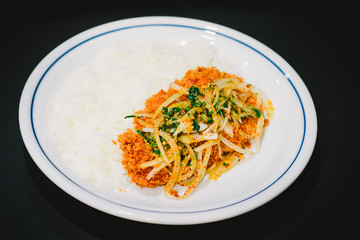  Thai cuisine mix spicy fried chicken with rice isolated on black background