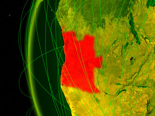 Angola from space on digital model of Earth with international networks. Concept of digital communication or travel.