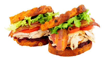 Chicken and bacon toasted sandwiches with cranberry jam isolated on a white background