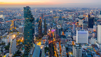 Fototapeta na wymiar Bangkok skyline and skyscraper with bridge link between mrt and bts mass transportation on Sathorn Road center of business in Bangkok, Aerial top view, Bangkok, Thailand