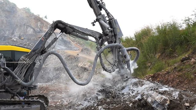 Rock surface drilling machine used to drill blast holes at quarry site