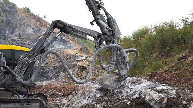 Rock surface drilling machine used to drill blast holes at quarry site