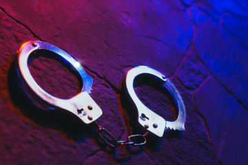 handcuffs on the floor at night