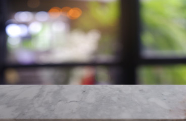 empty white marble stone table in front of abstract blurred background of cafe and coffee shop interior. can be used for display or montage your products - Image.