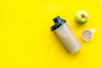 nutrition for workout with protein cocktail and fruits on yellow background top view mockup