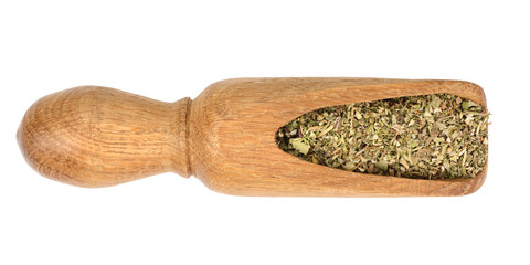 mix Provencal herbs in wooden scoop isolated on white background. Top view
