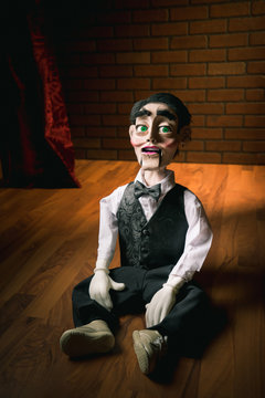 scary ventriloquist doll sitting on the floor