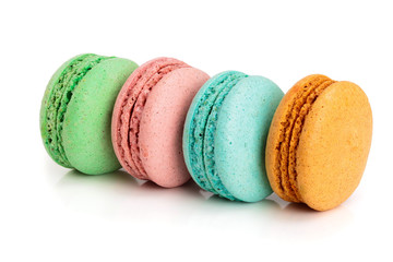 four macaroons isolated on white background closeup