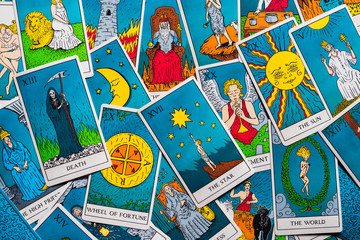 Tarot cards distributed randomly on top of each other