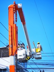 Electricians are repairing high-voltage electricity on high, to repair defective equipment, which...