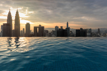 Kuala Lumpur, Malaysia - October 21, 2018: Infinity pool in front of the Petronas Towers in the city center