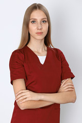 Smiling young nurse or surgeon  portrait isolated over white background.