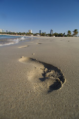 footprints in the sand by the sea