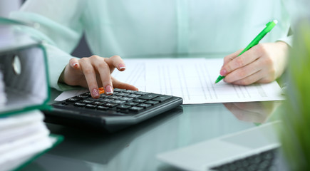 Bookkeeper or financial inspector  making report, calculating or checking balance. Audit and tax...