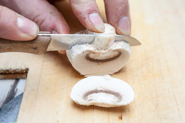 Fototapeta na wymiar Cutting a mushroom