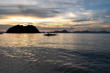 Naklejka na ściany i meble Beautiful sunset on the Maremegmeg Beach at El Nido, Palawan