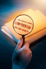 private detective desk with envelopes labeled as confidential