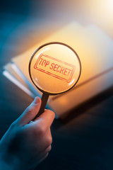 private detective desk with envelopes labeled as top secret