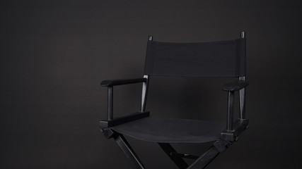 Black director chair use in video production , film, cinema industry on black background