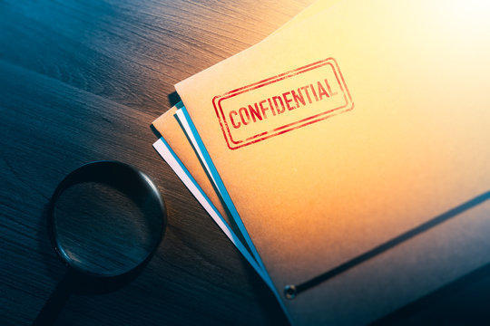 private detective desk with envelopes labeled as confidential