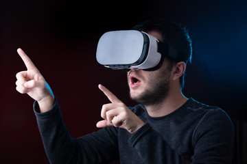 Photo of man in virtual reality glasses