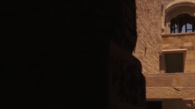 Close up of the courtyard of a building with standalone pillars