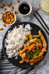 Kung Pao chicken, stir-fried Chinese sichuan traditional sichuan  dish with chicken, peanuts, vegetables and chili peppers.