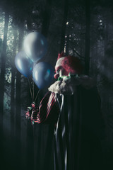 scary clowns holding balloons in a forest