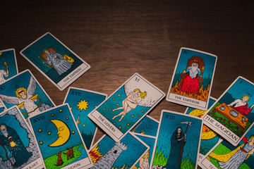 Tarot cards distributed randomly on top of each other