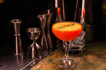 Alcoholic orange cocktail at the bar. Carrot Cocktail.