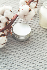 Natural spa cosmetics on a dark blue beton concrete background. Beauty blogger, minimalism concept, copy space