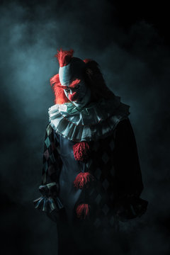 Scary clown on a dark background