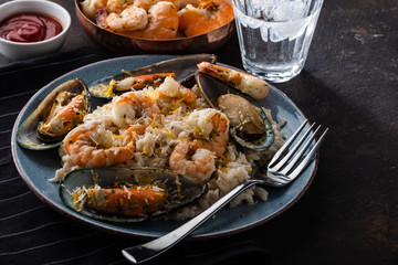 Risotto with seafood. Rice with shrimps and mussels.