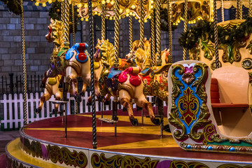 Close up view of Merry-Go-Round (carousel) illuminated at night. London, United Kingdom.