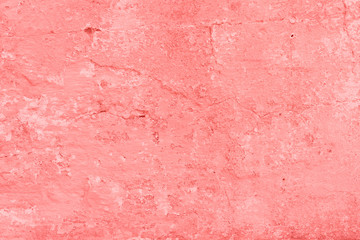 Texture, wall, concrete, living coral. It can be used as a background . Wall fragment with scratches and cracks