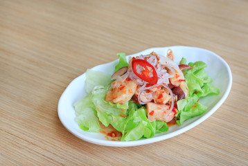 Japanese food, Spicy Octopus Tako salad on wooden table.