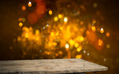 Bokeh background with empty wooden deck table for product montage display