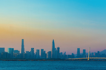 Fototapeta na wymiar Skyline of Shekou district, Shenzhen City, China under sunset. Viewed from Hong Kong