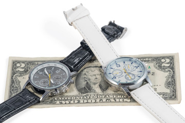 two wristwatches on dollars