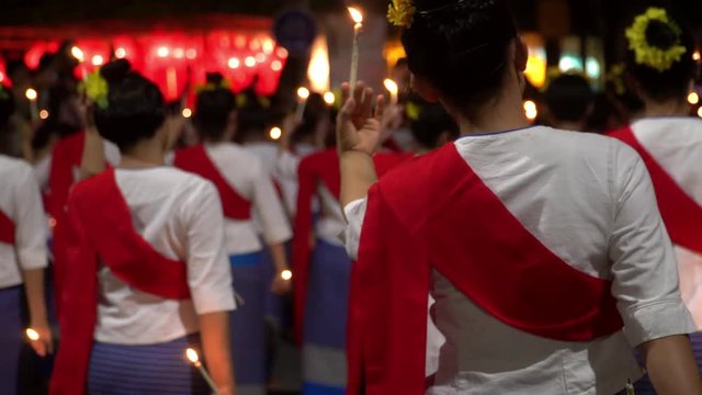 Young Women in National Costumes Perform Traditional Dance with Candles at Loi Kratong Festival
