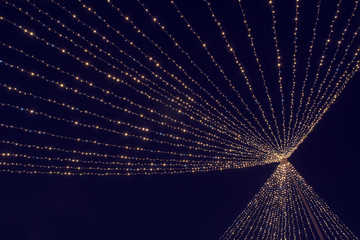 Christmas lights at Christmas Fair in Bucharest. Long exposure image. Selective focus.