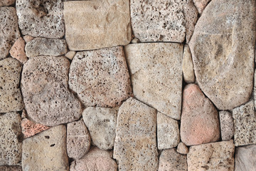 Wall of volcanic stone.