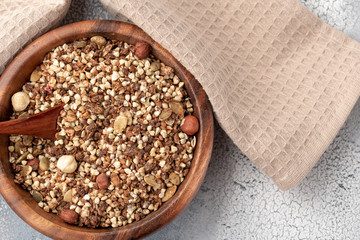 Healthy breakfast, vegan vegetarian granola made of green buckwheat with nuts and pumpkin seed