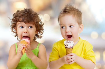 funny boy and girl eating ice cream - Powered by Adobe