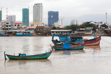 Fototapeta na wymiar Fishing boats on the Kai River in Vietnam