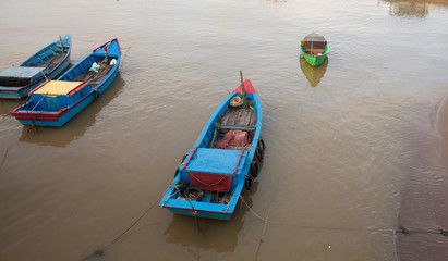Fototapeta na wymiar Fishing boats on the Kai River in Vietnam